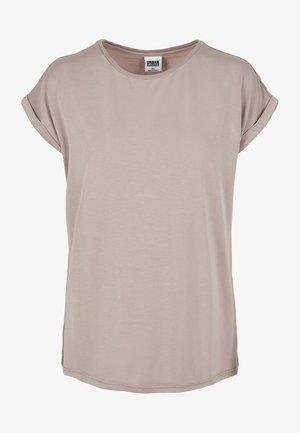 Kreemikasbeez T-särk pehmest kangast, ümmarguse kaelusega ja rullitud lühikeste varrukatega, külgpere ja lõdva lõikega.