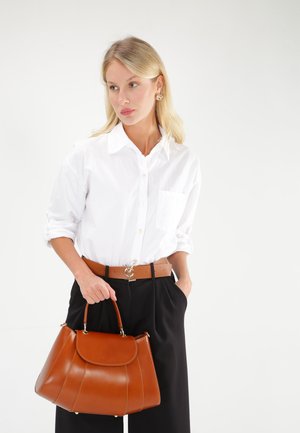 Brown leather handbag with a curved shape, rounded top, and textured finish. Features a single top handle and gold-tone hardware accents.