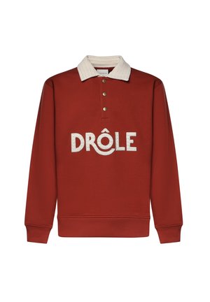 Felpa a maniche lunghe color ruggine con collo crema testurizzato, tre bottoni metallici e "DRÔLE" ricamato in grandi lettere crema sul davanti.