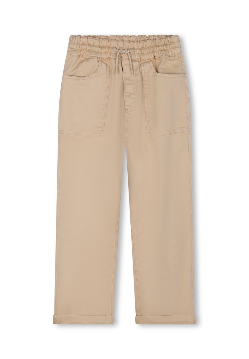 Pantalons beige avec une taille élastique, un cordon de serrage et deux poches avant. Le tissu est lisse avec un design ajusté et des ourlets retroussés.