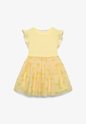 Abito giallo con maniche corte arricciate, corpetto aderente e gonna svasata con stampe di limoni e fiori. Tessuto morbido e leggero.