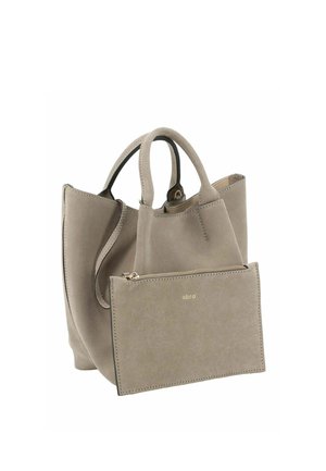 Kleine taupefarbene Wildleder-Einkaufstasche mit doppelten Griffen und passendem Reißverschluss-Beutel mit dem Markennamen „abro“ in goldenen Buchstaben.