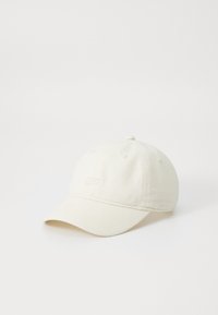 Cappello da baseball in cotone color crema con corona arrotondata, occhielli cuciti e visiera curva; presenta un ricamo del logo minimalista sul davanti.