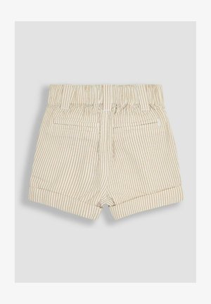 Svetlo bež kratke hlače z vertikalnimi belimi črtami, elastičnim pasom, dvema zadnjima žepoma in zavihkom na dnu.
