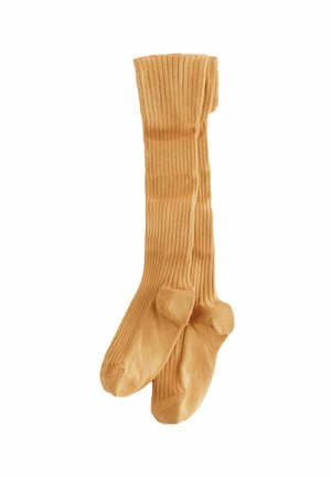 Beige gerippte kniehohe Socken aus einem weichen Material mit verstärktem Zehenbereich. Sie bieten eine enge Passform und eine gleichmäßige Farbe.
