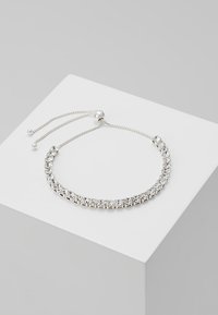 Silver bracelet featuring clear rhinestones set in a metallic chain, adjustable with a sliding bead closure. Smooth, shiny texture.