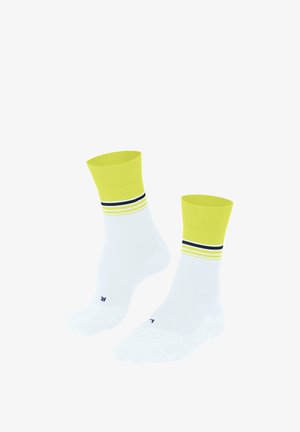 Chaussettes blanches avec une bordure néon jaune, ornées de plusieurs rayures horizontales en jaune et bleu marine. Comprend un logo au niveau des orteils.