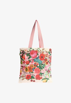 Canvas tote bag with pale pink straps, decorated with colorful flowers, fruit, a blue butterfly, and garden-themed text.