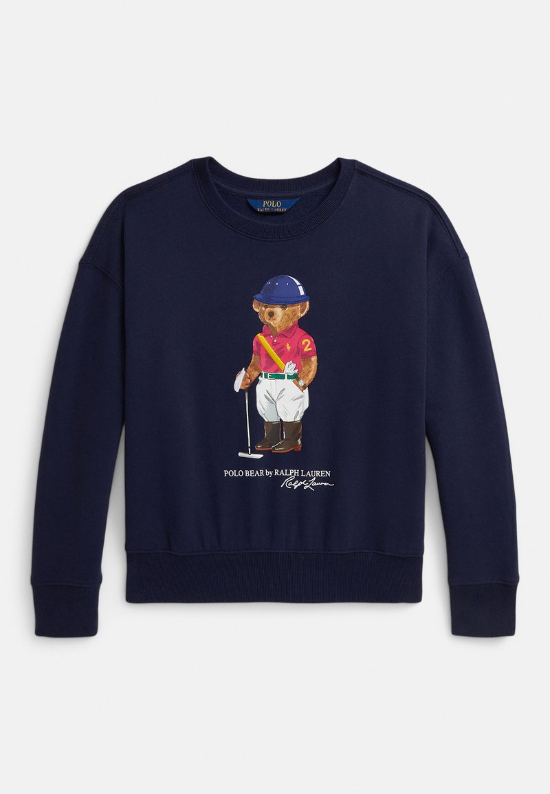 Temno modra jopa z medvedkom, oblečenim v polo opremo, ki drži kladivo, z napisom "Polo Bear by Ralph Lauren" spodaj.