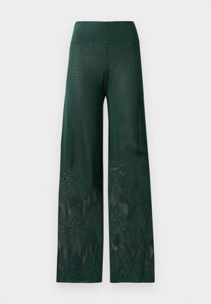 Pantaloni largi verzi din plasă ușoară, cu un model în zigzag la tiv. Prezintă un brâu neted pentru confort.