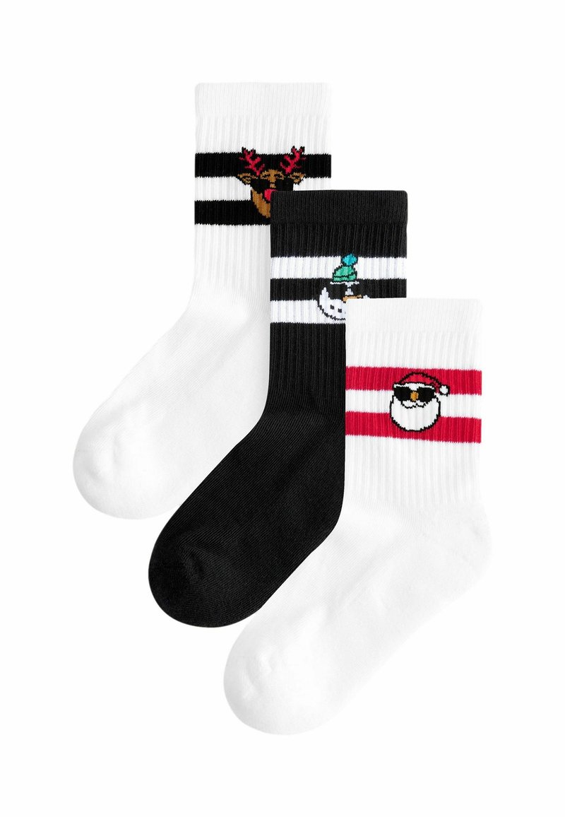 Tre par af ankelstrømper i sort, hvid og rød. Hver af dem har unikke designs med ferie-tema: rensdyr, snemænd og julemand.