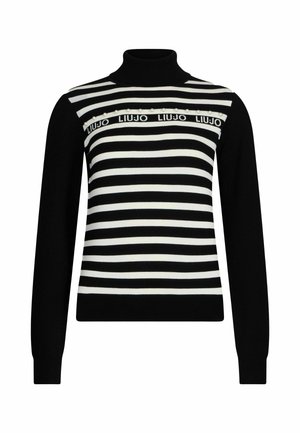 Maglione a collo alto a strisce bianche e nere con una texture a coste e strisce orizzontali, completo di un nastro con logo e perline decorativa sul petto.