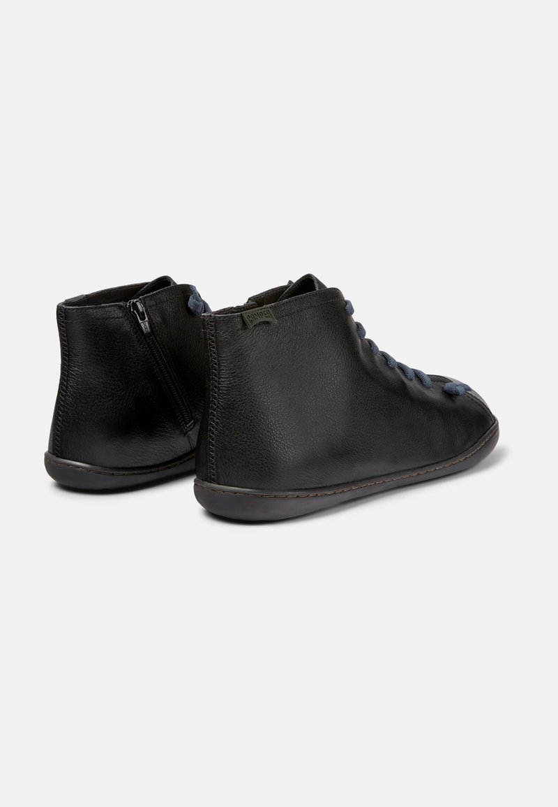 Black leather ankle boots with textured finish, round toe, blue laces, and side zipper. Tapered shape with a contrasting sole.