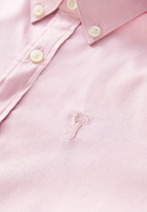 Light pink cotton shirt with a button-down collar, featuring white buttons and a small embroidered lobster design on the chest.