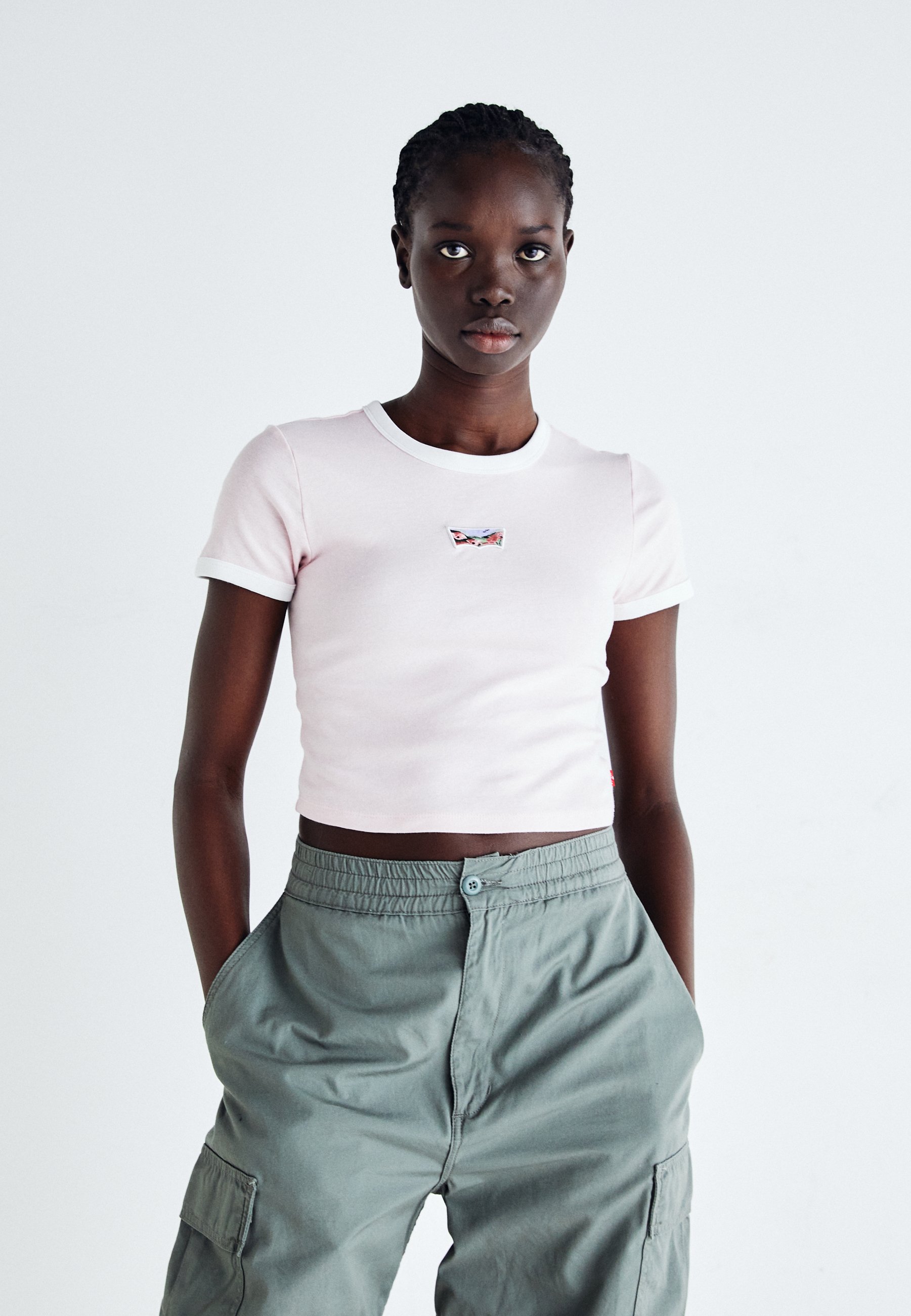 white shirt with pink graphic