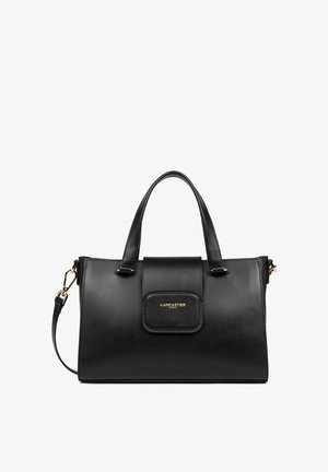 Black leather handbag with two short handles, detachable strap, gold hardware, and a front pocket featuring a logo on a textured panel.