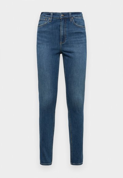 Jeans din denim albastru cu o croială slim, având o talie medie, design cu cinci buzunare și ușoare decolorări pe coapse și genunchi.