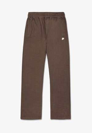 Hnědé, strukturované kalhoty s elastickým páskem, dvěma postranními kapsami a malým logem na levé noze. Design s rovnými nohavicemi.