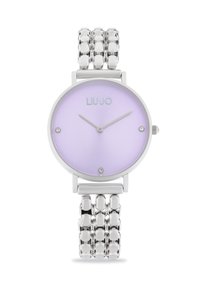 Orologio da polso argento con quadrante lilla, dotato di tre lancette minimaliste e indicatori a punto, abbinato a un bracciale in metallo a link.