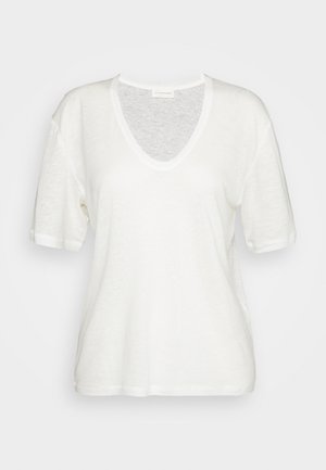 White, short-sleeve t-shirt with a V-neck design, featuring a relaxed fit and soft, textured fabric. No visible patterns or accents.