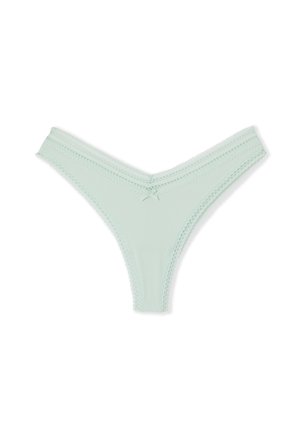 Tanga de color verde menta con ribetes acanalados, adornada con puntilla de borde ondulado y un lazo centrado en la parte delantera. Tejido suave con un diseño en forma de V.