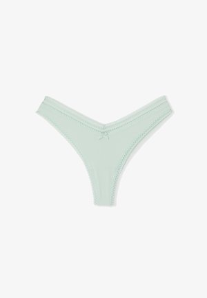 Thong en vert menthe avec des côtes, bordé de dentelle festonnée et un nœud centré à l'avant. Tissu doux avec un design en V.