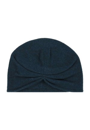 Dark blue knitted turban-style hat with a twisted knot detail at the front center.