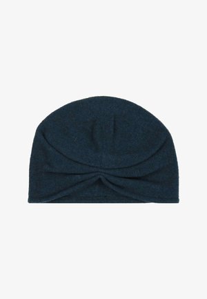 Dark blue knitted turban-style hat with a twisted knot detail at the front center.
