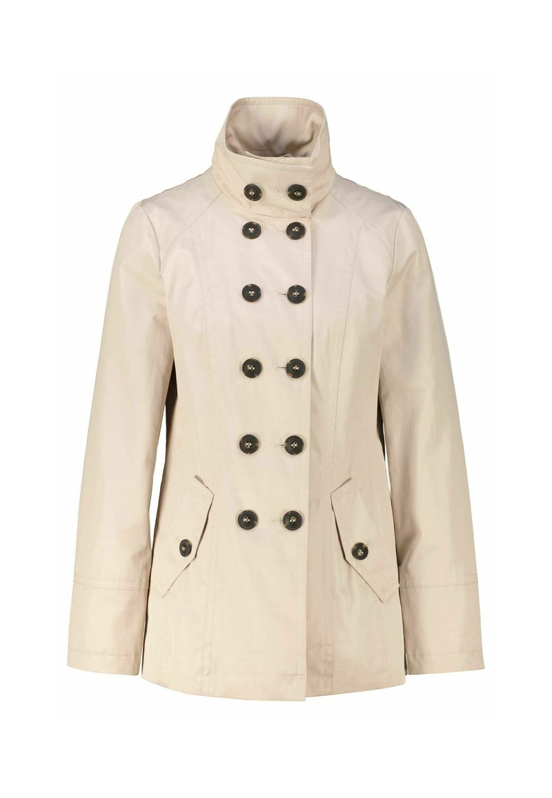 Beige jacket with a high collar, double-breasted design, six black buttons, and two front pockets. Smooth texture, long sleeves.
