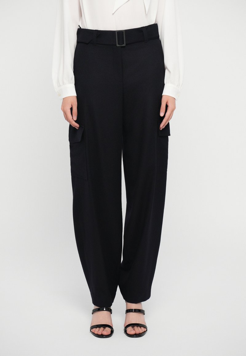 Black cargo trousers with a wide-leg cut, featuring two side pockets, a belt with a square buckle, and smooth fabric texture.