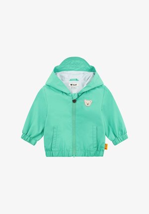 Giacca leggera con cappuccio di un vivace verde menta, con logo dell'orso, polsini elasticizzati e foderato a righe. Inclusi due taschini laterali.