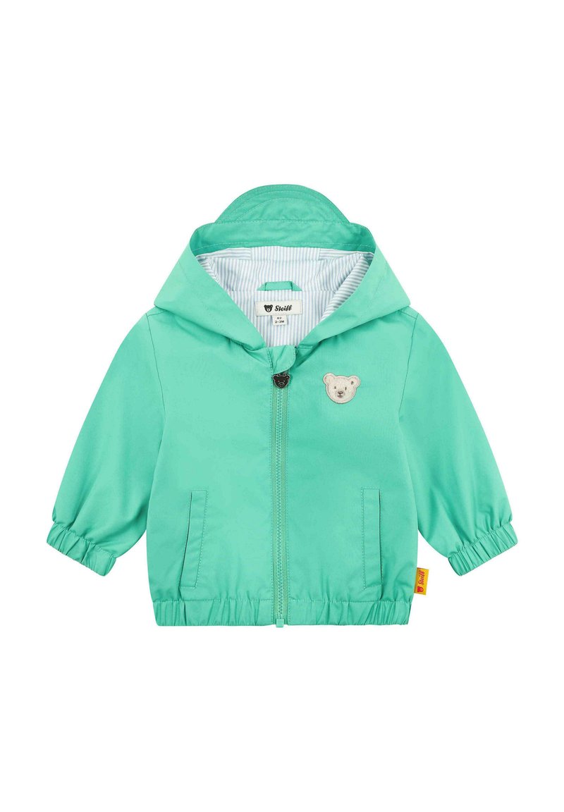 Lehká bunda s kapucí v živé mentolové barvě, se znakem medvěda, elastickými manžetami a pruhovanou podšívkou. Dvě boční kapsy.