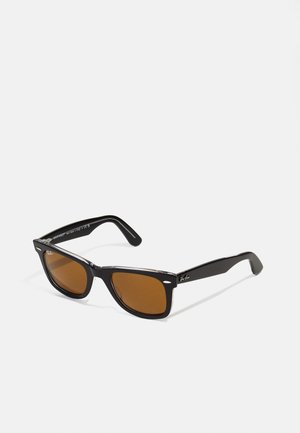 Black plastic sunglasses with a classic rectangular frame and brown tinted lenses. Features include silver accents and textured temple sides.