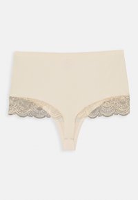 Beige truse med blondekant i et bølget mønster. Har en glatt tøy kropp med delikate, mønstrede blonde detaljer på sidene.