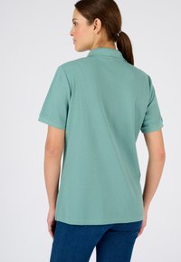 Damart Polo - vert grisé