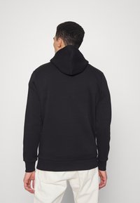 CLOSURE London SMOKING SKULL HOODY - Camisola - black