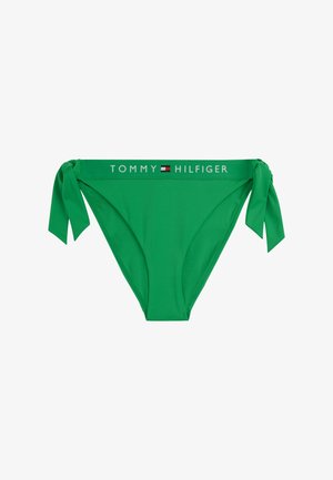 Zöld bikini alsó oldalsó kikötőkkel. Fehér színű, "TOMMY HILFIGER" felirattal és logóval ellátott márkás derékpánt jellemzi. Simogató, ruganyos anyag.