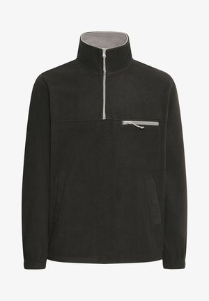 Svart fleece quarter-zip genser med høy krage, grått innermateriale, frontlomme med glidelås og elastiske mansjetter. Myk tekstur, uformell design.