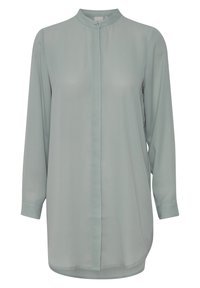 Light green, long-sleeve blouse with a high collar, front button closure, and a smooth, lightweight fabric. Rounded hem at the bottom.