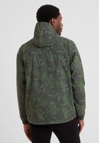Green patterned jacket with a hood, featuring an abstract brushstroke design, elastic cuffs, and a loose fit for ease of movement.