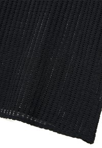 Black knitted fabric featuring a textured design with open weaves and vertical stripes, showing varying thicknesses and an even edge.