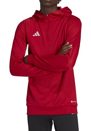 Rode sportieve hoodie met een ritskraag, lange mouwen en een textuurafwerking. Bevat het witte Adidas-logo op de borst en een geribbelde zoom.
