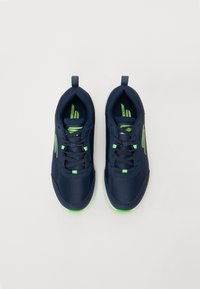 Navy blue athletic shoes with a textured mesh upper, green accents, and a rounded toe. Features include laces and a heel tab.
