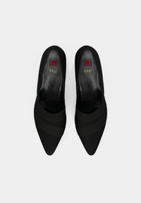 Black high-heeled shoes with a pointed toe, made from satin-like material. Features two horizontal fabric straps across the vamp.
