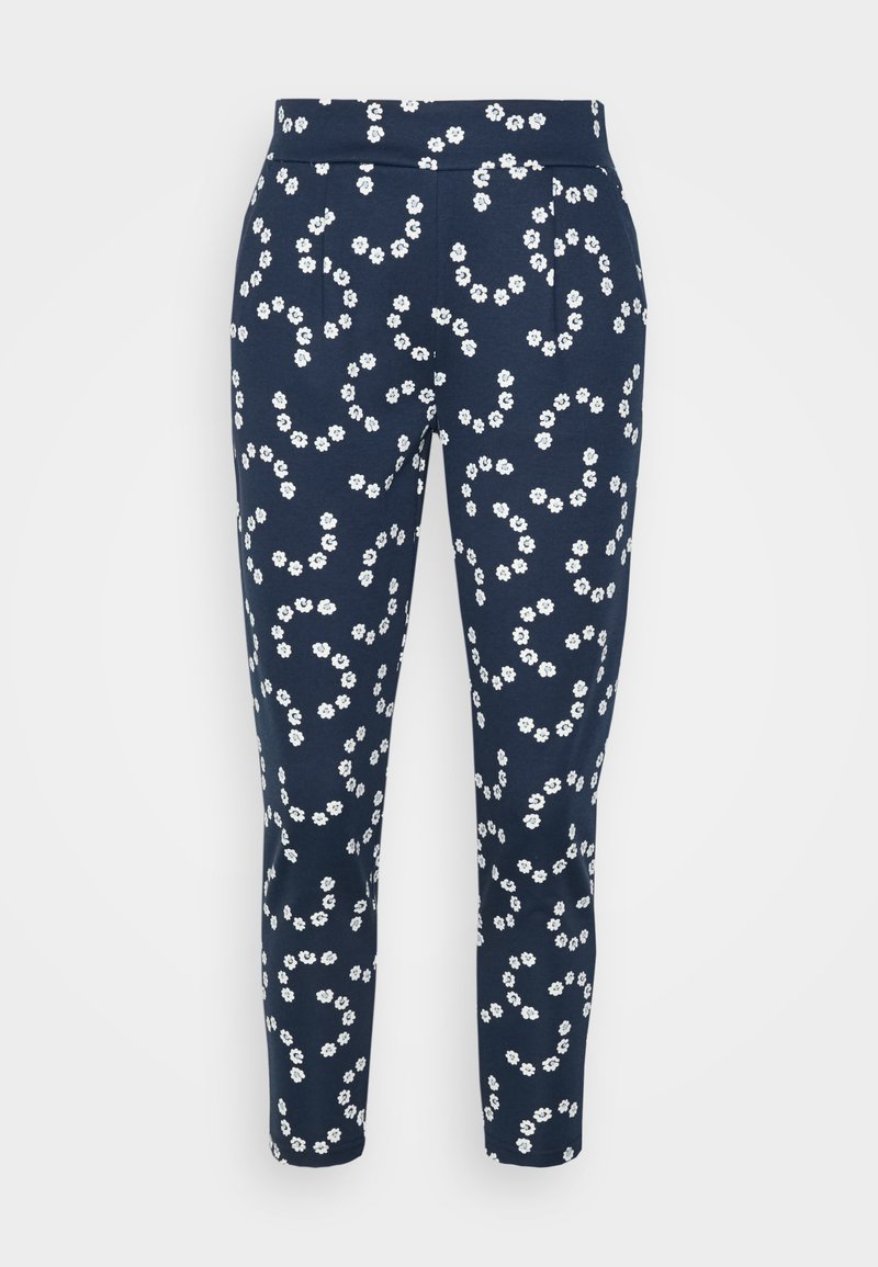 Pantalon bleu marine à jambes fuselées, avec un motif intégral de petites fleurs blanches et une taille ajustée.
