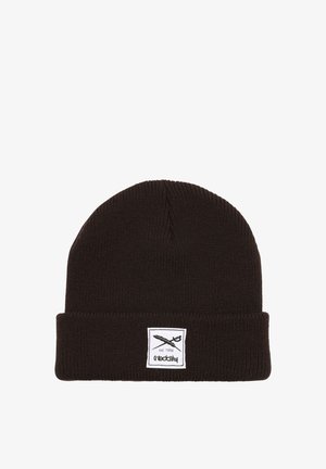 Brown knit beanie with a folded cuff, featuring a white label with black graphics and text. Soft texture, simple design, and no additional patterns.