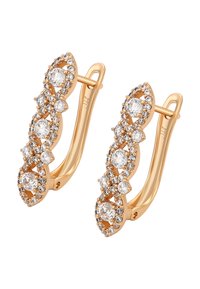 Zlaté náušnice s vlnitým designem zdobené několika �čirými krystaly, s lesklým, hladkým povrchem a složitými detaily.