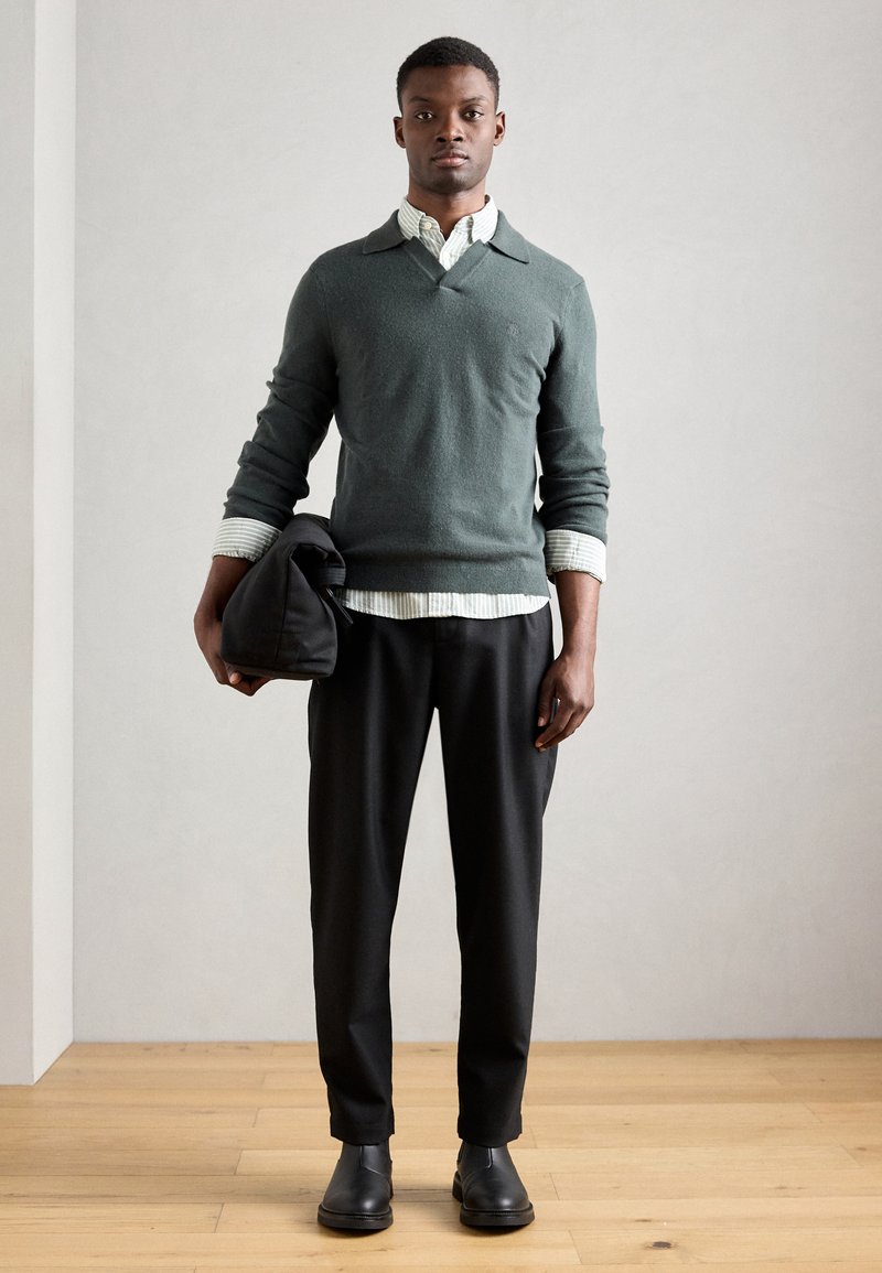 polo sweater over dress shirt Guide to Styling Sweater Polos for Men