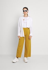 JDY JDYGEGGO LIFE  NEW LONG NOOS - Calças - harvest gold