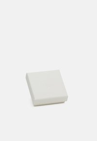 Square white box with a textured surface, featuring a subtle embossed logo on the top and a lid that fits snugly on the base.